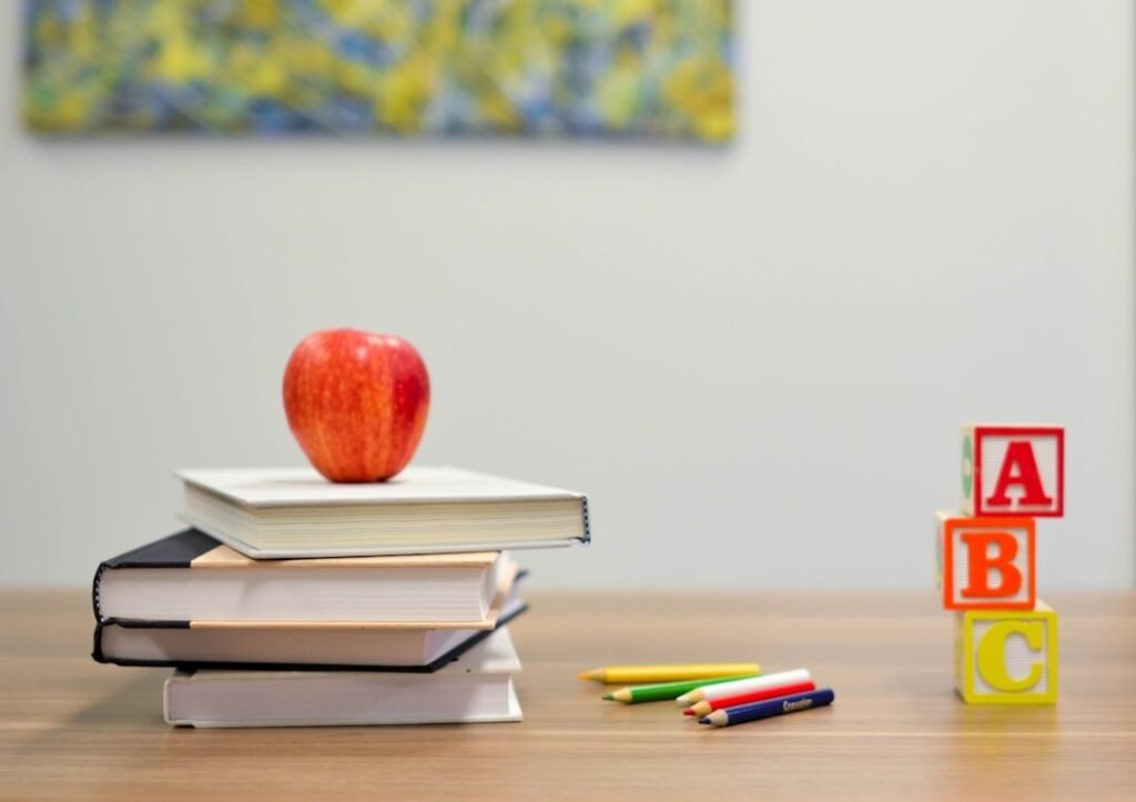 Books with Apple on top - Why learning French is a great decision